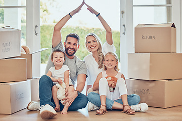 Image showing Portrait of happy family, new house and roof hands for insurance, safety and future investment in real estate. Moving, boxes and happiness, woman and man with kids in home with property mortgage.