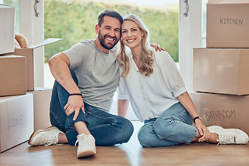 Image showing House, portrait and happy couple on floor of new home, real estate and property loan for relocation. Man, woman and partner moving in together for building investment, mortgage and boxes in apartment