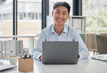 Image showing Laptop, smile and asian man secretary typing a schedule online, internet and web in an office happy at a company. Email, corporate and person or employee at information desk search on a website