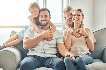 Image showing Portrait of mom, dad and children on sofa in living room for bonding, quality time and relax together. Happy family, smile and parents hugging girls for care, love and support at home on weekend