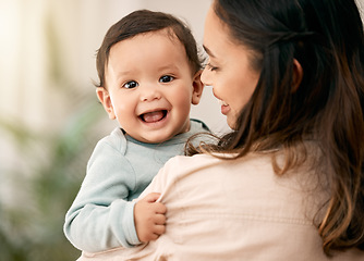 Image showing Portrait, baby and mother hug with love, smile and playing during morning bonding routine in their home together. Family, face and mom with toddler in living room having fun, embrace and relax indoor