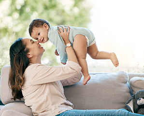 Image showing Love, airplane and mother with baby on a sofa for games, playing and laughing in their home together. Family, smile and mom with girl toddler on a couch, relax and flying, fun and hug in living room