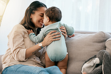 Image showing Love, happy and mother with baby on a sofa for playing, games and laughing in their home together. Family, smile and mom with girl toddler on a couch, relax and bonding, fun and hug in a living room