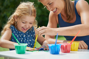 Image showing Happiness, mother and daughter painting, fun with art and messy with watercolor creativity outdoor. Woman with girl, mom bonding with female child and creative activity with color paint in backyard