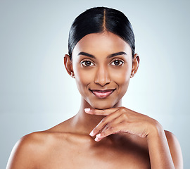 Image showing Smile, beauty and portrait of a woman with skincare cosmetic isolated in a studio white background. Clean, Cosmetics and natural female person or model hand on her face happy for self love or care