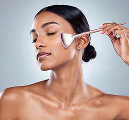 Image showing Blender brush, makeup foundation and woman with cosmetics, natural beauty and skincare. Cosmetic, young female model and care with contour and face product with highlighter for skin glow in studio