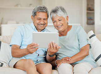 Image showing Technology, married couple with tablet and smile on couch in living room of their home. Connectivity, social networking and happy with elderly people on couch streaming a movie on sofa in house