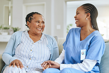 Image showing Senior woman, nurse and laughing together for support, healthcare and happiness at retirement home. Black person or patient and caregiver holding hands for trust, elderly care and help for wellness