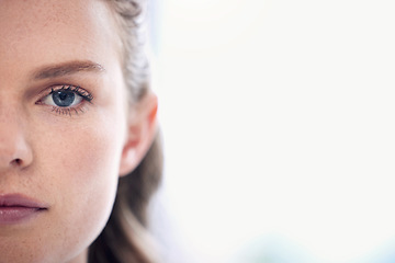 Image showing Woman, focus and half face with a healthy vision for awareness in australia for closeup. Serious, portrait and female person with eyes for concentration with eye test for wellness and seeing.