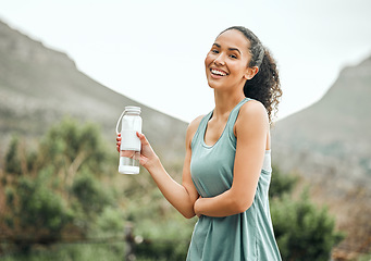 Image showing Woman with water bottle, smile in portrait outdoor with fitness, hydration and health with mockup space. Happy female person workout in nature, h2o drink and wellness with healthy active body