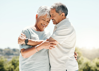 Image showing Senior couple, hug and happy in nature on vacation, holiday or summer bonding. Love, hugging and retirement of man and woman with a smile and enjoying quality time together on intimate date mockup.
