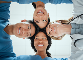 Image showing Happy, teamwork or faces of doctors in huddle with a smile collaboration for healthcare mission goals. Smiling, team building or low angle of nurses with group support, motivation or private secrets