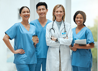 Image showing Portrait, leadership and a doctor woman arms crossed, standing with her team in a hospital for healthcare. Insurance, medical and teamwork with a female health professional in a clinic for treatment