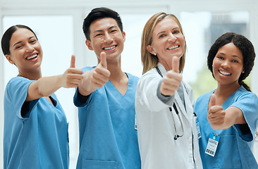 Image showing Teamwork, happy or portrait of doctors with thumbs up for healthcare, medical consulting or success. Thumb up, nurses or surgeons smiling with good hand gesture for diversity in hospital together
