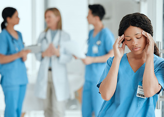 Image showing Headache, anxiety or sad nurse in meeting with doctors with burnout, stress or fatigue with medical emergency. Migraine, tired black woman or depressed surgeon with depression or loss in hospital