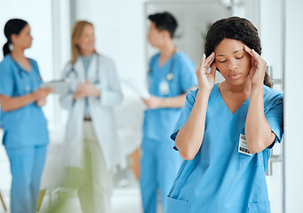 Image showing Headache, anxiety or sad surgeon in meeting with doctors with burnout, stress or fatigue with medical emergency. Migraine, tired black woman or depressed nurse with depression or loss in hospital