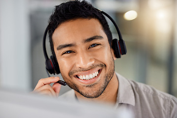 Image showing Young man, call center portrait and smile for telemarketing with headphones, microphone and sales. Indian guy, customer service agent and tech support for contact us, happy and listening in office