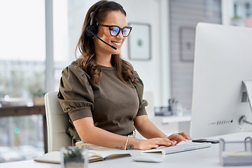 Image showing Happy, call center and a woman typing on a computer for telemarketing, consulting and customer service. Smile, contact us and a female sales employee with a pc for communication, support or advice