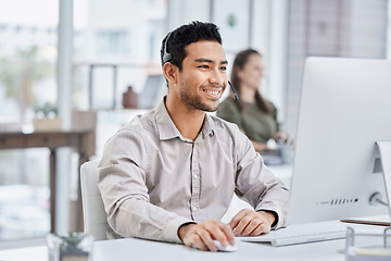 Image showing Business, telemarketing and man with a smile, call center and advice with headphones, typing and connection. Male person, consultant and agent with computer, customer service and advice with success