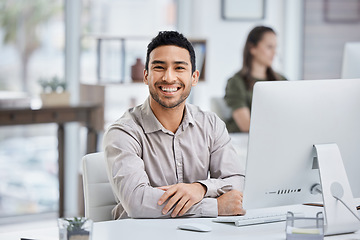 Image showing Businessman, smile and portrait with a computer at desk for research, planning and internet connection. Happy asian male entrepreneur with a desktop pc in a modern office for a corporate project