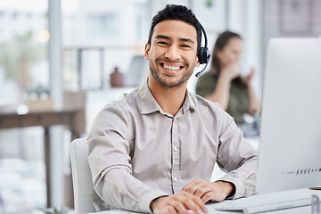 Image showing Customer service, portrait of male call center agent with headset and with computer at his desk of a modern office workplace. Telemarking or support, communication and male person at his workstation