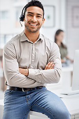 Image showing Portrait, customer care and support with a man consultant in his telemarketing office for assistance. CRM, contact us and consulting with a male employee using a headset in a retail call center