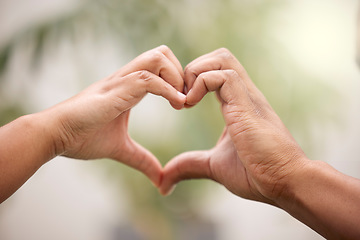 Image showing Heart, hands sign and couple outdoor for care, affection or bonding together. Love, hand gesture and man and woman support, trust or empathy, kindness and emoji for commitment, marriage and loyalty.