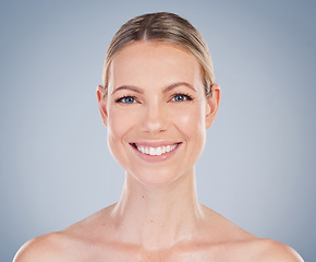 Image showing Beauty, skincare and smile with portrait of woman in studio for facial, cosmetics and natural makeup. Self care, wellness and mockup with face of model on grey background for glow, happy and collagen