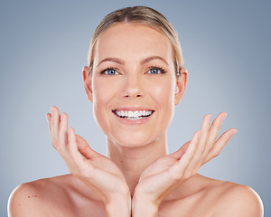 Image showing Beauty, smile and portrait of woman in studio for facial, cosmetics and natural makeup. Self care, wellness and mockup with face of female model on grey background for glow, happiness and collagen