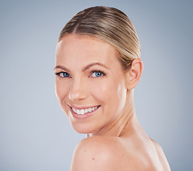 Image showing Beauty, skincare and portrait of woman in studio for facial, cosmetics and natural makeup. Self care, wellness and mockup with face of female model on grey background for glow, happiness and collagen