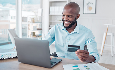 Image showing Credit card, online shopping and black man use laptop, internet or web for ecommerce purchase in an office. Businessman, African and employee making payment on a website in a company office