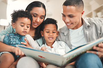 Image showing Young happy family, kids reading and couch for story, book and learning together in home, love and bonding. Parents, education and children on living room sofa with smile, care and support in house