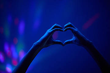 Image showing Lights, heart hands of fan at party or concert at night, stadium lighting and bokeh with mock up. Music festival, love hand sign in silhouette and live performance show with neon light in arena space