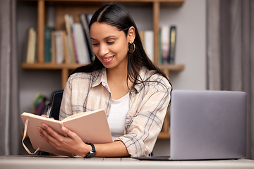 Image showing Laptop, book and education with a student woman in a university library to study for a final exam or test. Technology, learning and journal with a young female college pupil reading research material