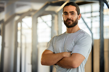 Image showing Portrait of man in gym, mockup and arms crossed with fitness mindset, confidence and health tips. Workout, exercise and face of confident personal trainer at sports club with muscle and mock up space