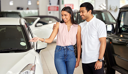 Image showing Couple at car dealership, choice and transport with smile, people buying new vehicle with luxury and customer. Happy with decision, man and woman at automobile showroom, purchase and transportation