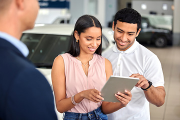 Image showing Tablet, car and showroom with couple and salesman for vehicle shopping, test drive and consulting. Auto, transportation and purchase with man and woman in dealership for insurance, sale and motor