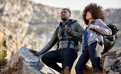 Image showing Hiking, adventure and fitness with couple in mountains for journey, climbing and travel. Relax, trekking and environment with black man and woman hiker in nature for exercise, health and motivation