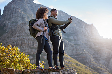Image showing Camera, fitness and couple hiking, view and exercise for wellness, health and cardio with happiness. Training, black man and woman with workout, picture and memory with a smile, hike and adventure