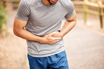 Image showing Fitness, stomach ache and man outdoor after running, workout or exercise. Sports, abdominal pain and male athlete in nature with injury, emergency or problem, sick or hernia after training mockup.