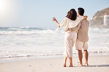 Image showing Couple hug on beach, sea and back view with trust, travel and vacation in Mexico with love and bonding outdoor. Mockup space, summer and people together in nature with relationship and commitment
