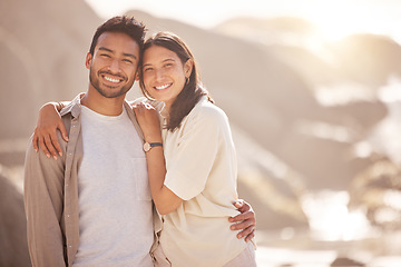 Image showing Portrait, couple and holiday with hug at ocean with happiness in the summer on the weekend. Face, smile and man with woman at the beach for travel with the sunshine for bond together on a trip.