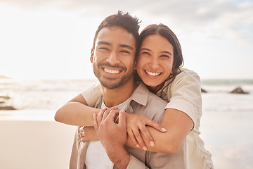 Image showing Portrait, hug and couple at the beach with happiness for a vacation in the summer having fun. Together, hugs and ocean for holiday with smile for the weekend with sunshine for relaxing and bonding.