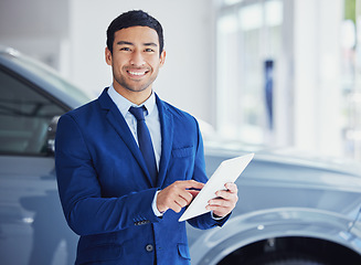 Image showing Portrait, tablet and car salesman smile at dealership, workshop or workplace. Face, technology and male person at showroom for motor vehicle shopping, business owner or sales manager in retail store.