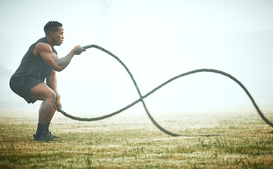 Image showing Exercise, battle rope and black man on field for power workout for body building, training and muscle strength. Fitness, sports and bodybuilder on grass with ropes, energy and outdoor sport in mockup