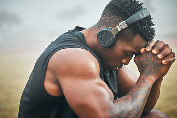 Image showing Music, training and thinking with black man in park for exercise, strong and motivation. Streaming, sports podcast and radio with male athlete and headphones for muscle, workout and challenge