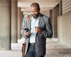 Image showing Cellphone, coffee and businessman in city commuting to corporate office while networking. Travel, town and African male employee browsing on social media, mobile app or internet while walking to work