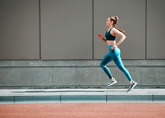 Image showing Young woman, urban running and city sidewalk with training, exercise and fitness on road. Street, runner profile and female athlete with mockup and body workout for health, wellness and race outdoor