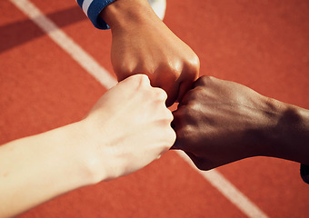 Image showing People, diversity and fist bump in fitness for teamwork, unity or trust together on stadium track above. Hands of group touching fists in team building for sports motivation, agreement or goals