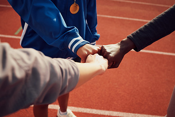 Image showing People, diversity and fist bump in fitness for unity, trust or support together on stadium track. Hands of group touching fists in team building for sports motivation, teamwork or goals outdoors